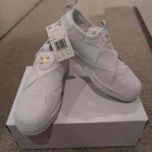 Adidas White Slip-On Sneakers with Gold Logo